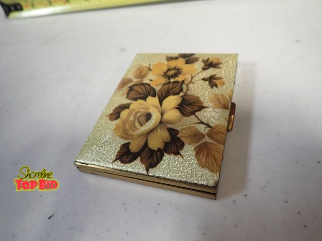 Lot 59-41496 - Mid century 1950's gold with flower decorated cigarette holder