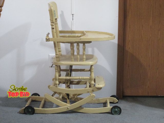Lot 59-10096 - Antique rolling high chair.  The chair is very solid, wood in good condition.  Paint is very old, ei...