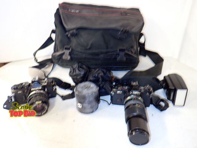 Lot 59-50000 - 2 Olympus Cameras with accessories and Carrying Bag