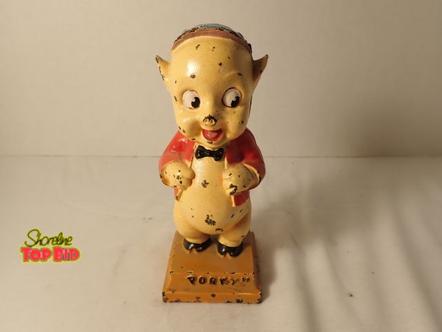 Lot 59-20048 - 1930s Hubley Cast Iron Porky Pig Still Bank. Est. Value $50-$195, 6" tall