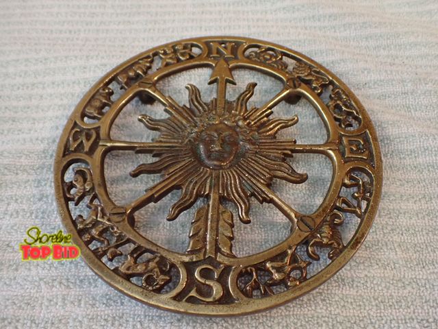 Lot 59-21405 - 1965 Kebler Brass Mid-Century Zodiac Trivet Celestial Sun Face Design Surrounded by Astrological Sig...