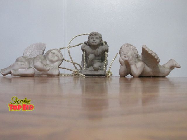 Lot 59-10076 - lot of 3 youthful angels (2 reclining, the third sitting in a tree swing), good condition.