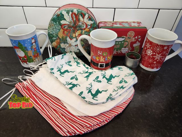 Lot 59-97010 - Christmas lot! 3 mugs, 2 tins, tea candle, 15 handmade stockings (3 designs). Great for teacher gift...