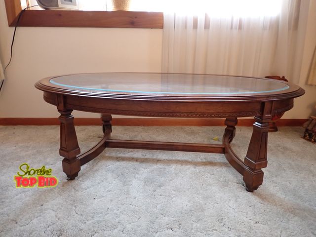 Lot 59-43253 - Walnut Oval Glass Top Coffee Table on Casters