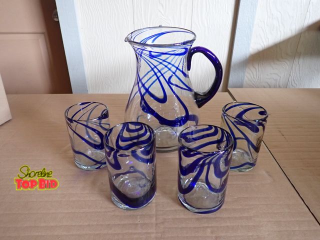 Lot 59-43919 - Hand Blown Mexican Glassware - 5 pieces - pitcher trimmed in cobalt blue with 4 swirl glasses - all ...