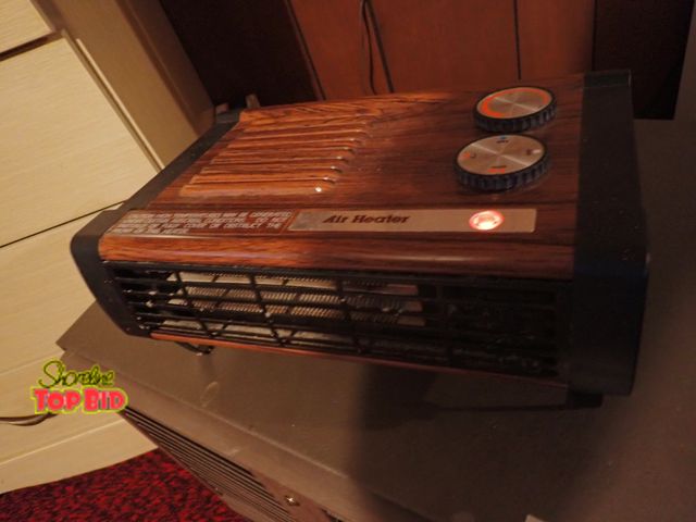 Lot 59-43024 - Small Portable Heater, Electric with a Faux Wood Grain Finish. Tested - Working