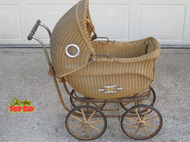 Lot 59-10044 - Antique wicker baby buggy.  cloth lining is ripped (shown in listing pictures) and needs to be repla...