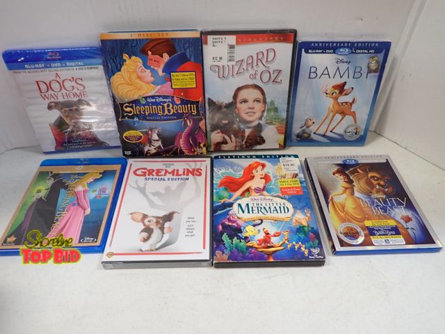 Lot 59-43423 - 8 Kids DVD Movies - all CDs are in cases some never opened still sealed