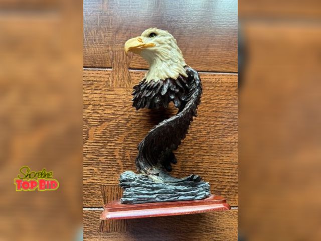 Lot 59-43521 - American Bald Eagle on wooden stand.  Tall 9” resin  like new.