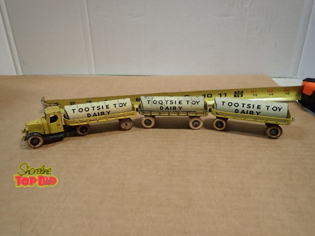 Lot 59-20066 - 1930s Tootsie Toy Dairy Diecast Tractor with 3 Pressed Tin Tankers, Rare Set