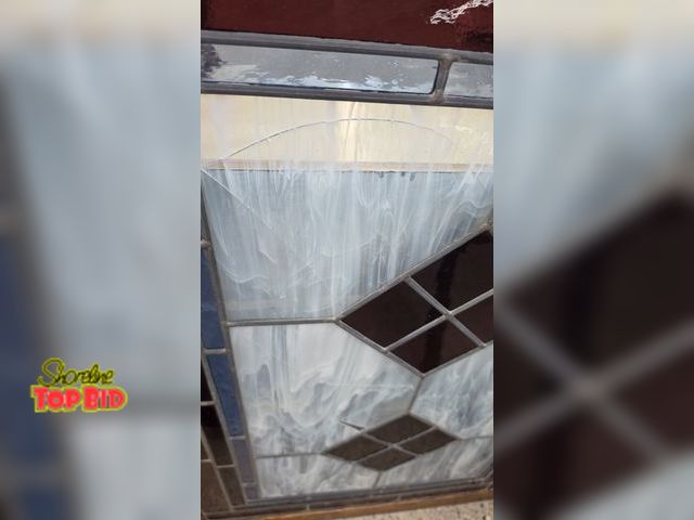 Lot 59-95003 - OFFSITE  Framed stained glass art 42.5 in tall 30 in wide Crack on upper left side, upper right side...