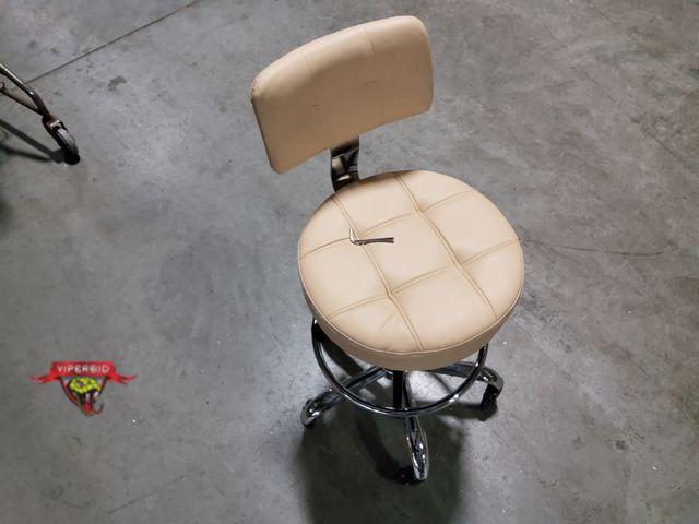 Lot 7-130952 - Faux Leather rolling swivel stool with adjustable height.