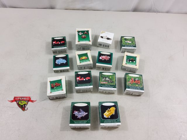 Lot 7-123498 - (14) Assorted Hallmark miniature vehicle Christmas tree ornaments.