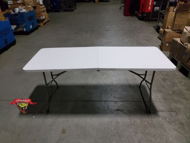 Lot 7-134543 - 27-1/2" X 6 Ft. Light duty Folding table. Top does not sit flat - still usable.