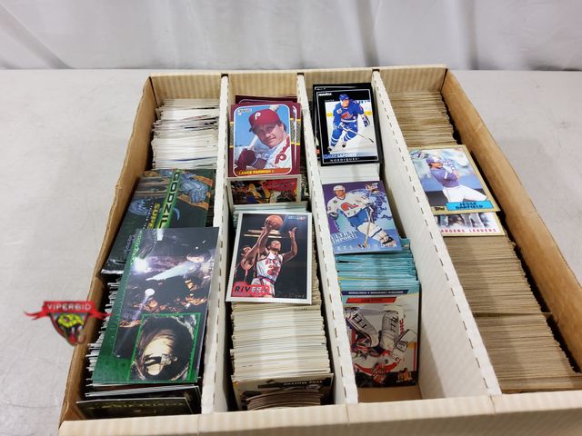 Lot 7-134833 - Lot of assorted baseball, hockey, basketball, and Godzilla cards. Cards may have duplicates.