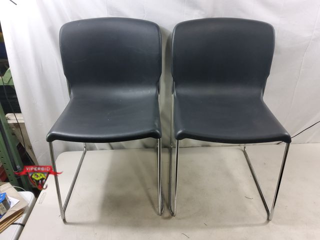 Lot 7-131431 - (2) Plastic / metal frame chairs. Stackable. 17-1/4"W X 30-3/4"H.