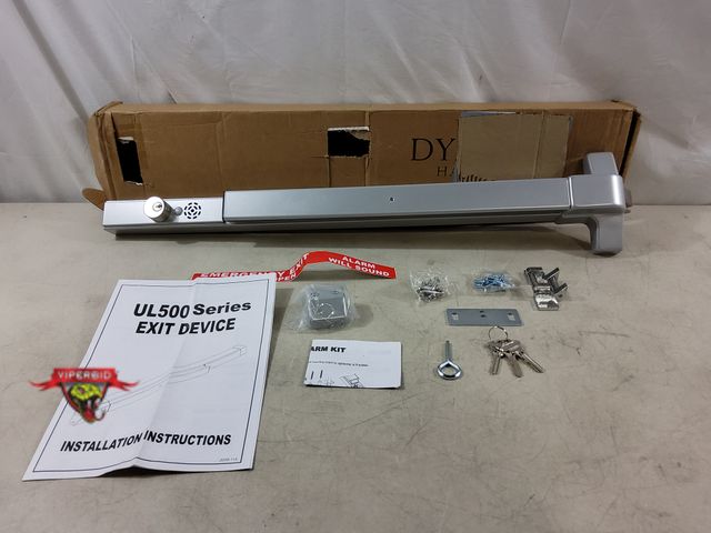 Lot 7-133616 - Dynasty Hardware commercial door push bar panic exit device with alarm. 32"L. Lockable with keys.