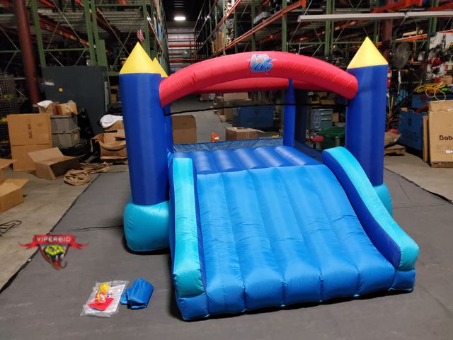 Lot 7-131395 - Action Air Inflatable Bouncer with Air Blower.  12'L × 9'W × 6.1'H
