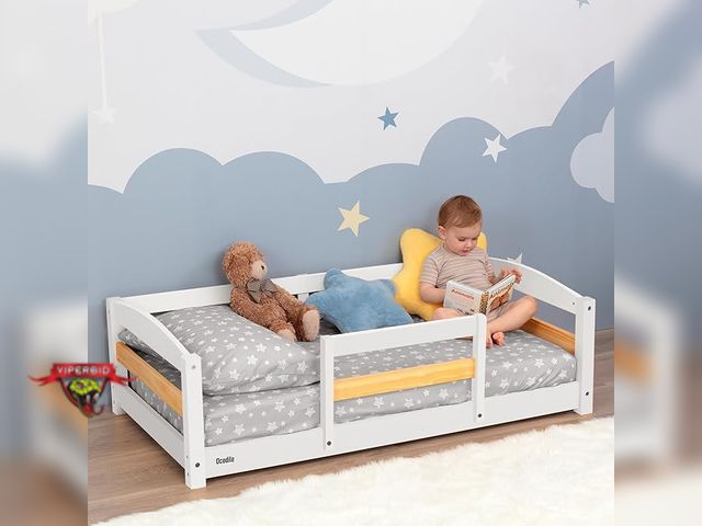 Lot 7-130377 - Retail value $149! Looks new! Ocodile wooden toddler bed. Holds standard size crib mattress.