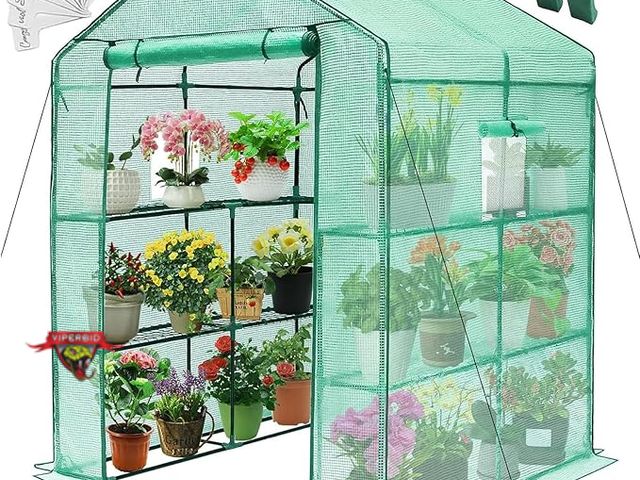 Lot 7-130478 - Looks new! Greengro Greenhouse with 8 shelves. Approximately 57 x 57 x 76''.