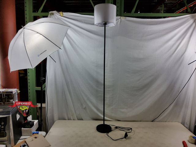 Lot 7-130677 - 5 ft floor lamp with foot switch and fabric shade.