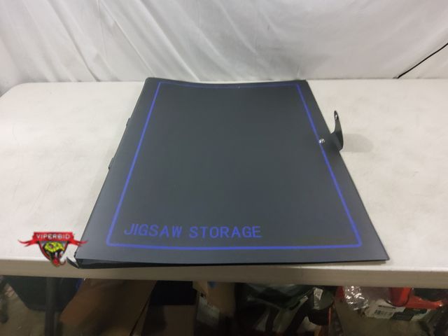 Lot 7-132503 - Jig-Saw Puzzle Storage Binder Holds up to (20) 30" x 25" Puzzles. Note: Small Rip on bottom (see pic...