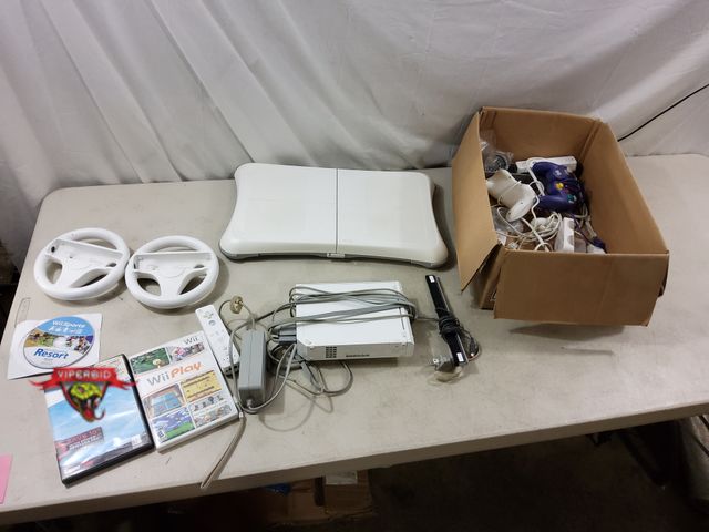 Lot 7-132657 - Wii game system with accessories and (3) Games.
