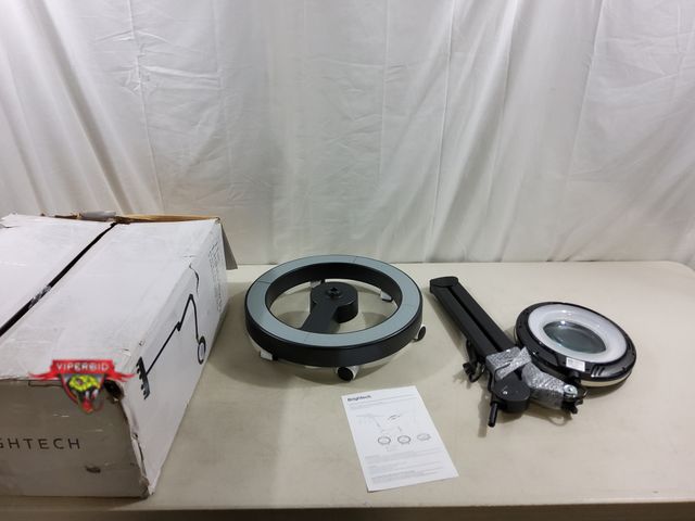 Lot 7-123725 - BrightTech The Lightview Pro light magnifier with black rolling base. 3 Dipoter lens.