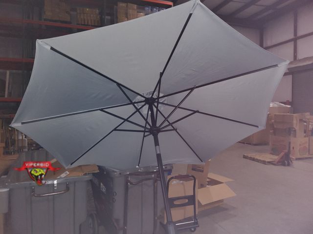 Lot 7-130435 - 9 ft. Round Patio umbrella.