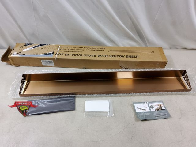 Lot 7-132623 - Stutov 30" magnetic metal stove shelf.
