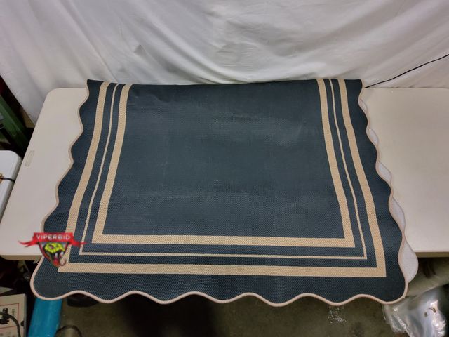 Lot 7-130679 - 4 ft. X 6 ft. Patio / Sun Room area rug with anti slip back.