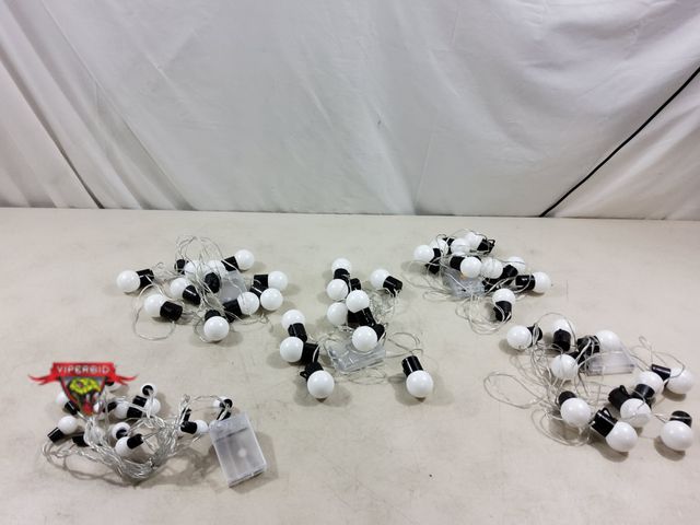 Lot 7-134276 - (4) 10 Light / 12 Ft battery operated lights and (1) 16 light strand.  (2) "AA" batteries each - not...
