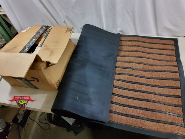 Lot 7-134847 - 47" X 31-1/2" Entrance mat with rubber back.