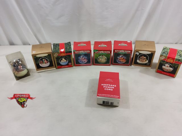 Lot 7-123579 - (1) Tomorrow Today Motion ornament, (7) Hallmark magic light and motion ornaments and a Hallmark kee...
