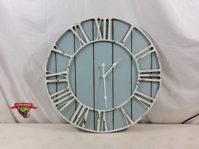 Lot 7-134102 - 23-1/2" Dia. Battery operated wall clock. Requires (1) "AA" Battery. Note: Metal hands a bit bent - ...