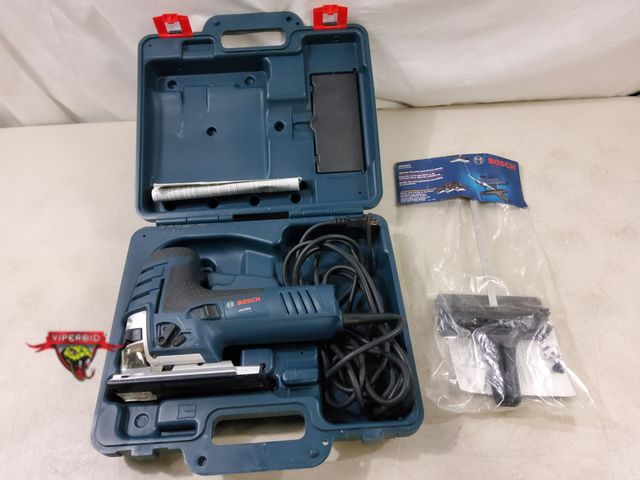 Lot 7-130468 - Bosch corded jig saw with hard case and new parallel &amp; circle guide.  120V. Model JS470EB.