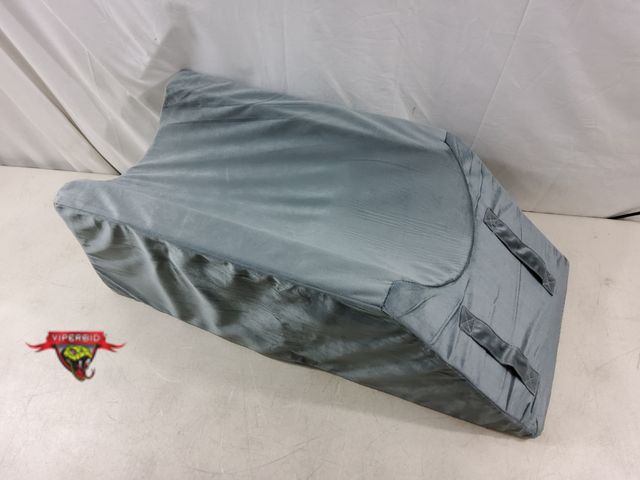 Lot 7-134333 - Megcxit wedge leg pillow. 9"H.