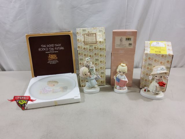 Lot 7-123505 - Lot of Precious moments. Includes Bundles of Joy figurine, The Hand That Rocks The Future plate, Sta...