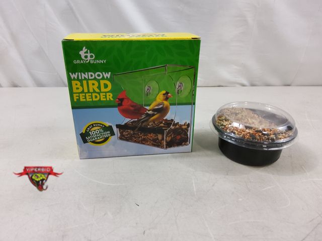 Lot 7-131611 - New! Gray Bunny window bird feeder with a container of bird seed.