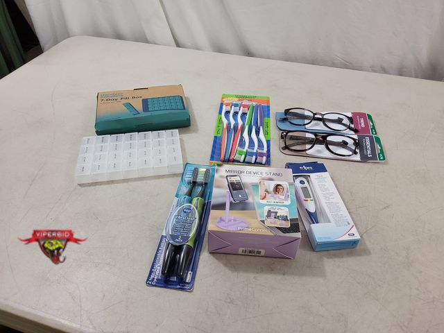 Lot 7-134697 - (2) Pairs of +1.75 reading glasses, (2) Packs of toothbrushes, Apex digital thermometer, mirror devi...