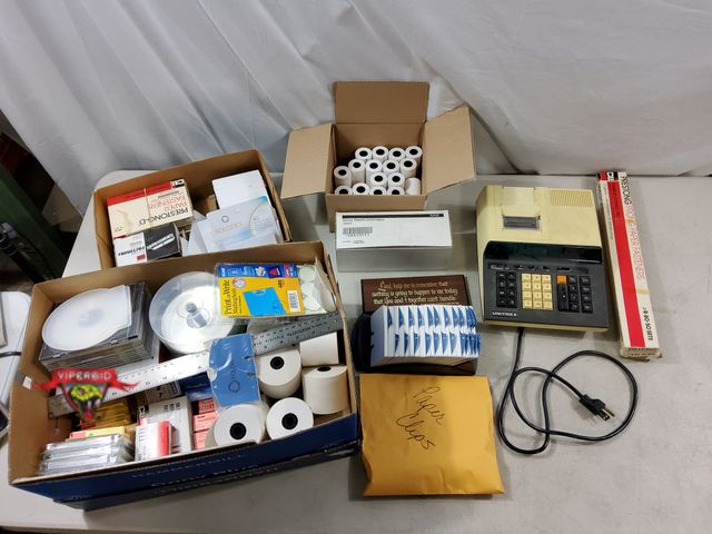 Lot 7-133379 - Lot of assorted office supplies. Includes electronic printing calculator.