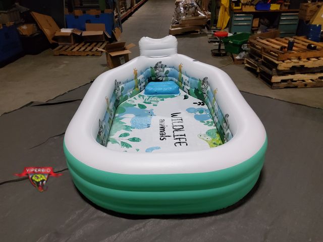 Lot 7-131285 - Retail value $99! Lightly used. Inflatable swimming pool with seat and backrest. 118" X 75" X 20". A...