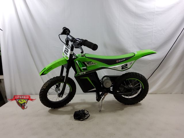 Lot 7-134564 - Razor SX125 McGrath 12V Electric powered dirt bike with charger. Works!