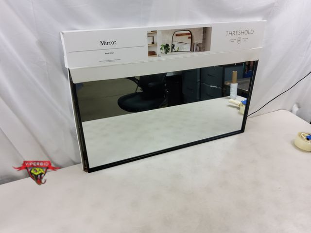 Lot 7-131768 - Threshold framed mirror. 24" X 35-3/4".