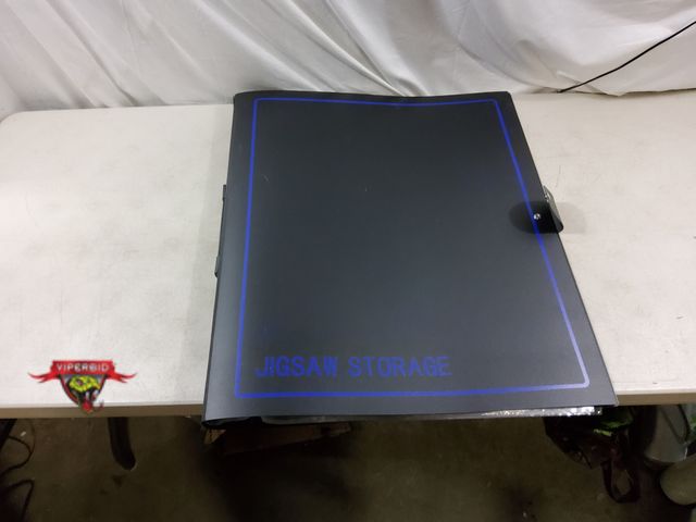 Lot 7-132883 - Jig-Saw Puzzle Storage Binder Holds up to (20) 30" x 25" Puzzles.  Note: Small Rip in top Crease of ...