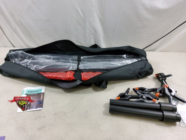 Lot 7-134414 - Emart photoback drop stand. Note: Bag torn.