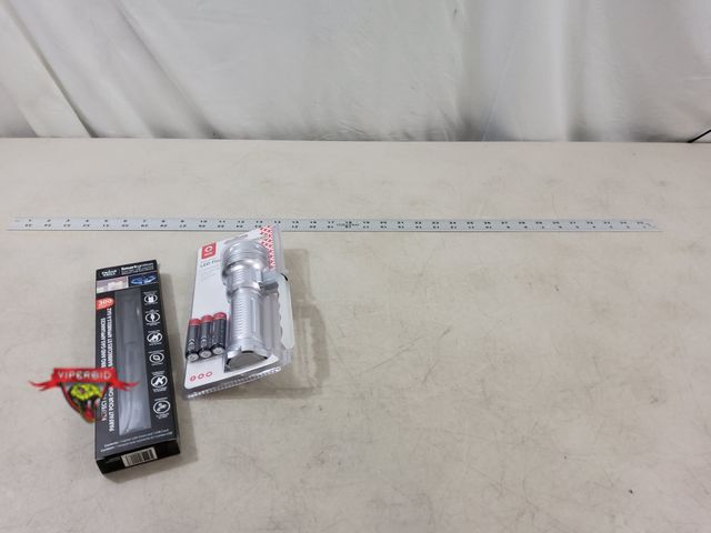 Lot 7-134704 - New! 36" Aluminum yardstick, Led flashlight with batteries, and an electric usb lighter.