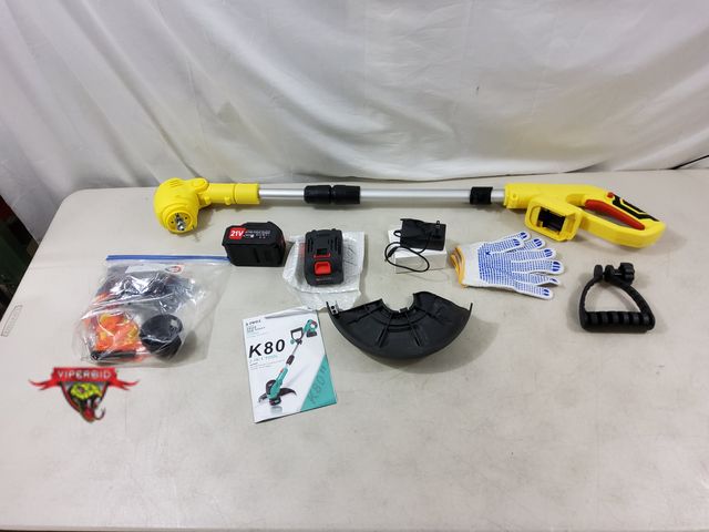 Lot 7-130788 - JWDJ K80 21 V Cordless Grass Trimmer with charger and (2) Batteries. Tested to power on.