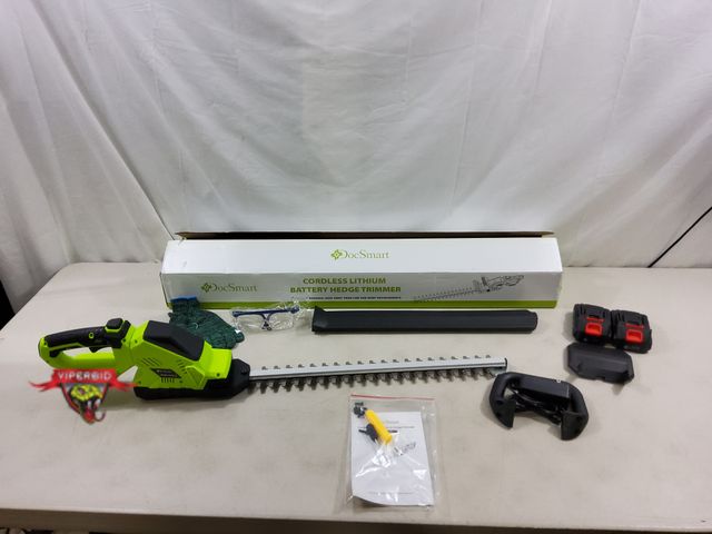 Lot 7-131174 - DocSmart cordless lithium battery hedge trimmer. Model HT02-G. Includes battery and charger.