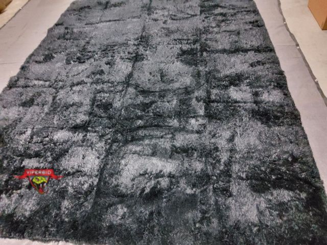 Lot 7-134873 - 13-1/2 ft. X 10 ft. Faux fur area rug.